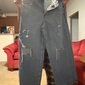 Distressed blue jeans